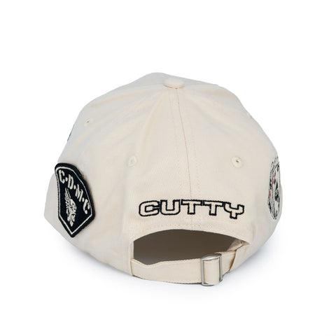 Cutty Triumph Curved Peak Cap – Natural / Off-White