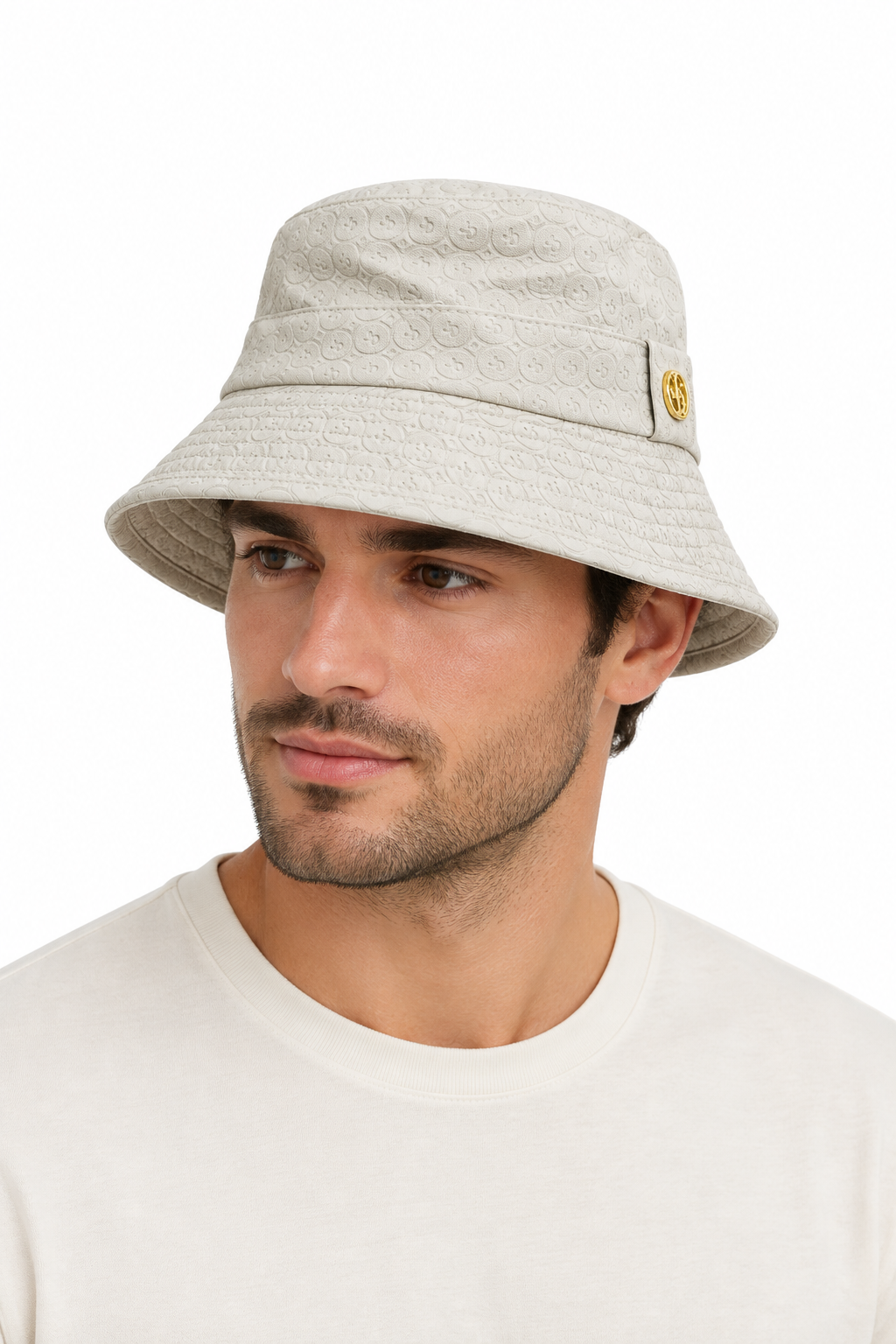 Male model wearing a cream textured bucket hat with gold badge