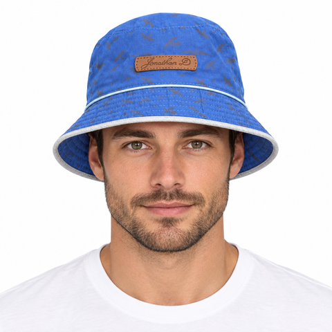 Model wearing Jonathan D bucket hat blue bird-patterned side on white background