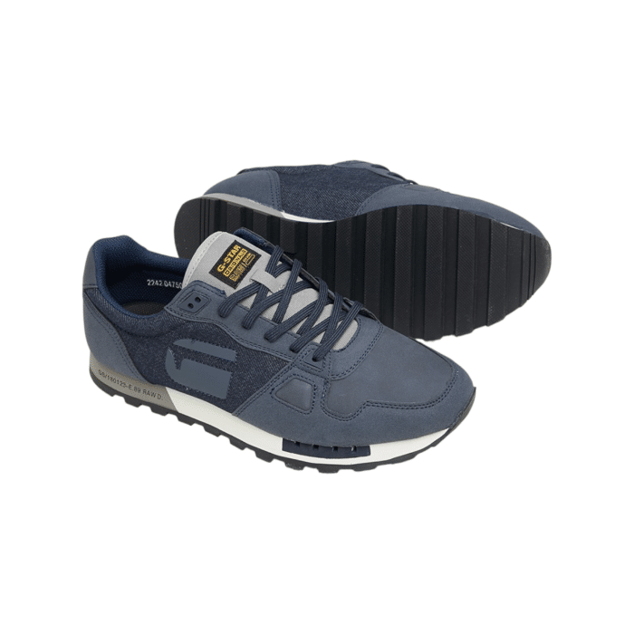 806 26B | The G-Star Track DNM M in Navy is a modern, versatile sneaker featuring a sleek denim upper. Its contemporary design and deep navy hue provide a stylish touch, making it suitable for both casual and semi-formal occasions.