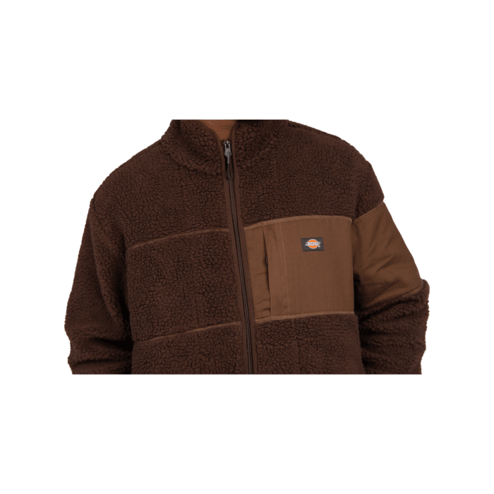 377 3B | The Dickies Seattle Chute Fleece LS Zip Thru in Brown Multi Colour blends warmth and style seamlessly. Crafted from a cozy cotton-polyester blend, it features a zip-through design, practical pockets, and elasticated cuffs for comfort and functionality in cooler weather. Ideal for layering or as a standalone jacket, it offers versatility and durability for everyday wear.