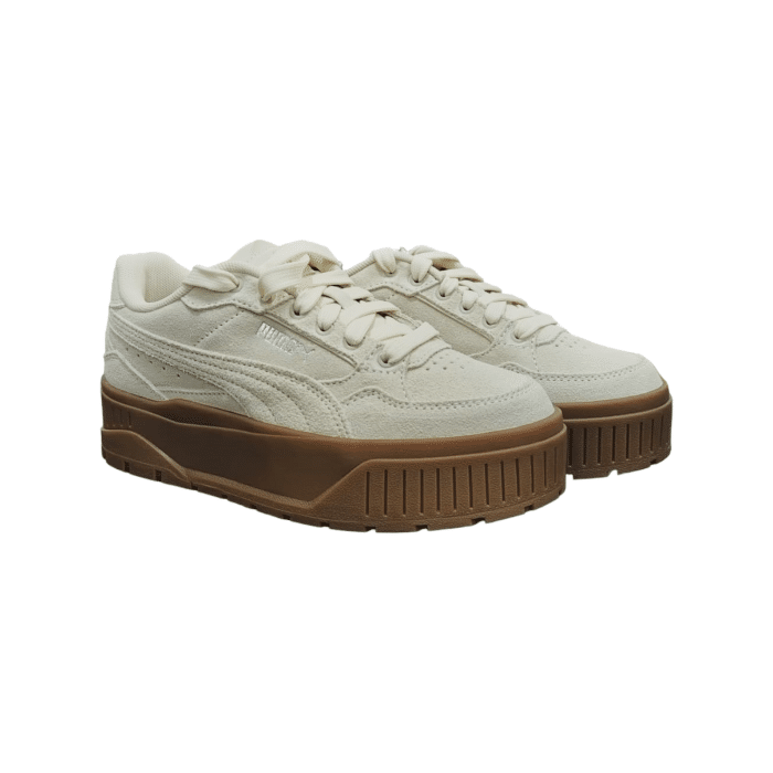 334 83B | The Puma Karmen II Idol SD in Frosted Ivory features a luxurious suede upper and a durable rubber sole, combining elegance and practicality. Designed for all-day comfort, these versatile sneakers seamlessly transition from casual outings to more polished occasions.