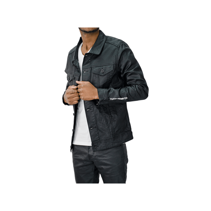 96 49B | The Cutty Wax Denim Jacket Wade in Black is a masterful blend of classic design and contemporary style, offering a sleek, polished look that seamlessly transitions from day to night. Its waxed finish provides a unique texture and enhanced durability, making it a standout piece for any wardrobe.