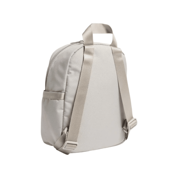 255 23A | The <em>Nike Futura Mini Backpack</em> in Grey is a compact yet stylish accessory, perfect for daily essentials. With a 6-liter capacity, it offers just enough space to carry your must-haves, while maintaining a sleek and modern profile. Designed for both comfort and convenience, its durable material and adjustable straps ensure it fits seamlessly into your active lifestyle.