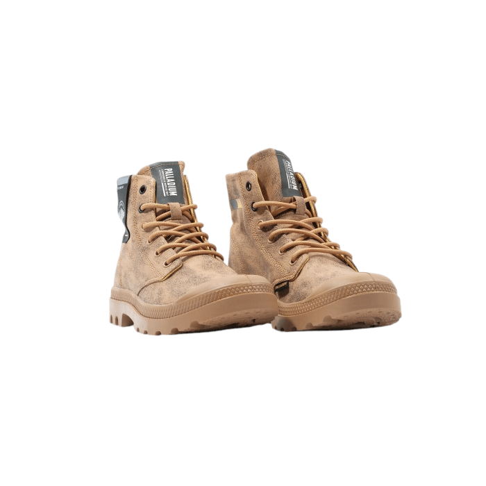 530 180B | The <em>Palladium Pampa Surplus</em> in Cannela Tan Colour combines rugged military-inspired design with modern versatility, making it an essential boot for adventurous spirits. Crafted from durable canvas with a warm tan hue, these boots offer both style and practicality, perfect for exploring the outdoors or enhancing urban outfits. With its sturdy rubber outsole and cushioned footbed, the <em>Palladium Pampa Surplus</em> ensures long-lasting comfort and reliable traction across any terrain.