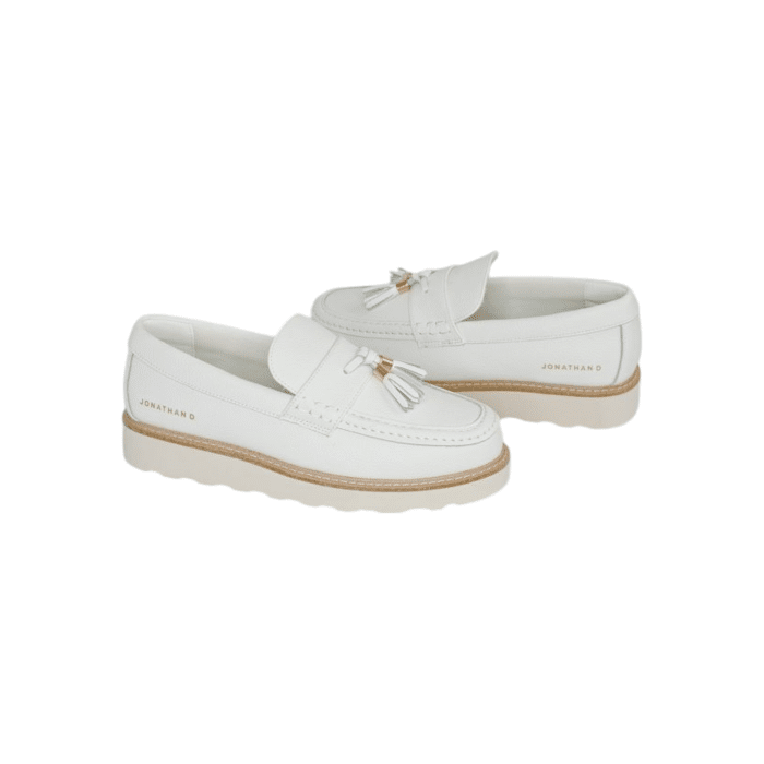 55 48A | The Jonathan D Scout Tassel PU Leather shoes in White color effortlessly combine sophistication and modern style, making them a versatile addition to any wardrobe. Crafted from high-quality PU leather with a sleek tassel detail, these shoes offer a polished look that's perfect for both formal occasions and smart-casual outfits.