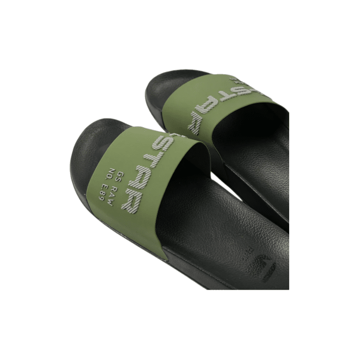 894 6c | Step into sleek, everyday comfort with the G Star Cart V TPU Slides in Black/Olive, crafted from 100% Thermoplastic Polyurethane for lasting durability and flexibility. These minimalist slides feature a monochromatic design that adds a subtle yet stylish edge to any casual look. Perfect for indoor or outdoor wear, they deliver a soft and supportive feel, making them an essential for laid-back days.