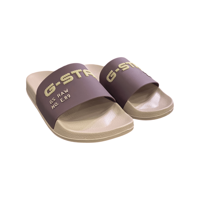 961 4B | Step into comfort and style with the G Star Cart V TPU Slides in a chic Pink, featuring crisp dark pink detailing on the top. Designed from durable 100% Thermoplastic Polyurethane, these slides offer both flexibility and resilience for everyday wear. Please note, these slides are not washable, ensuring their unique design and material stay intact over time.