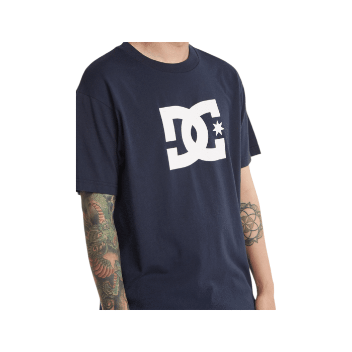 1090 3B | The DC Shoes T Shirt Star Logo S/S Navy-White combines simplicity and style with its rich navy color and iconic white DC logo emblazoned across the chest, delivering a timeless look that’s both bold and versatile. Crafted from premium 100% cotton, this tee offers all-day comfort and durability, making it a perfect staple for casual outings, skate sessions, or laid-back gatherings. With its classic crew neck and standard fit, the shirt provides a flattering and comfortable feel that pairs effortlessly with jeans, shorts, or layered under a jacket for year-round wear.