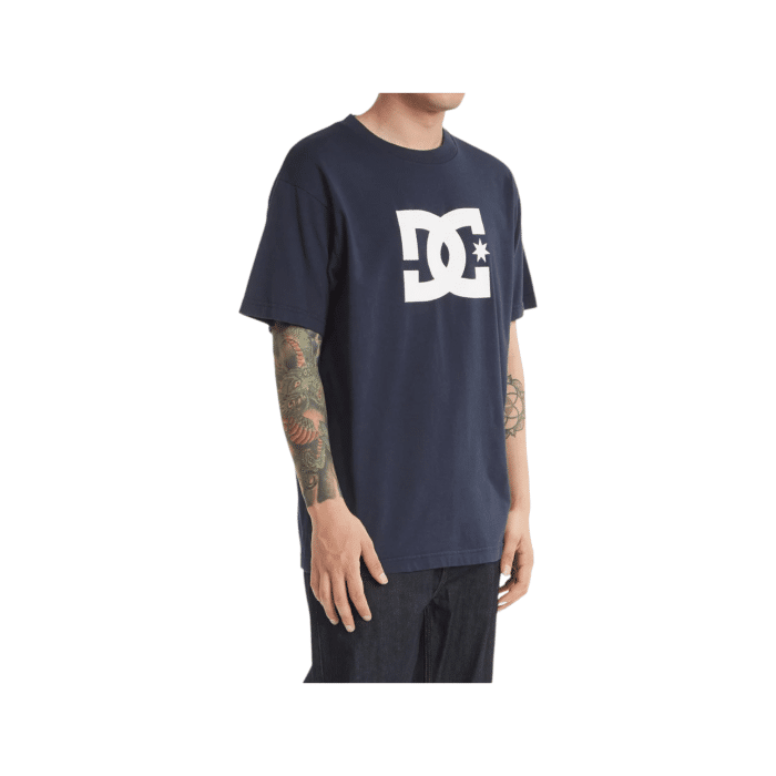 1090 3C | The DC Shoes T Shirt Star Logo S/S Navy-White combines simplicity and style with its rich navy color and iconic white DC logo emblazoned across the chest, delivering a timeless look that’s both bold and versatile. Crafted from premium 100% cotton, this tee offers all-day comfort and durability, making it a perfect staple for casual outings, skate sessions, or laid-back gatherings. With its classic crew neck and standard fit, the shirt provides a flattering and comfortable feel that pairs effortlessly with jeans, shorts, or layered under a jacket for year-round wear.