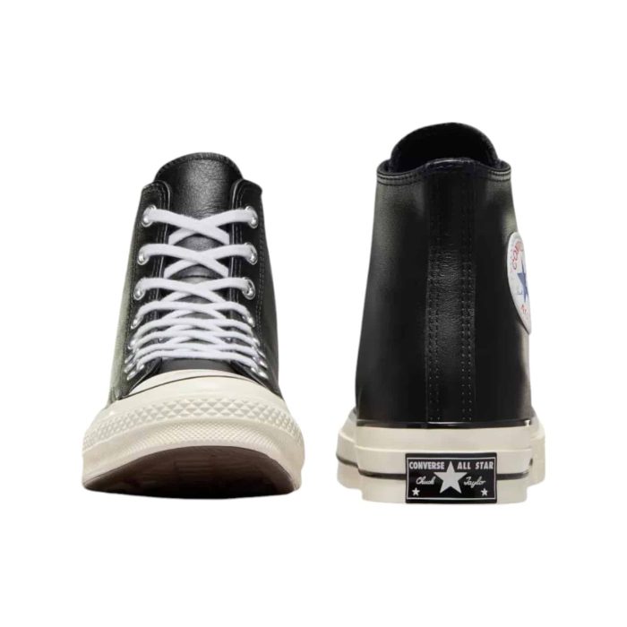 129 16D | The Converse Chuck 70 Hi Leather in Black/Egret is a premium, modern take on the iconic high-top sneaker, crafted from sleek black leather for a refined yet durable finish. Featuring enhanced cushioning with an OrthoLite footbed, it delivers superior comfort and support for all-day wear, while maintaining its classic style with vintage-inspired details like the Egret midsole and signature rubber toe cap. With its versatile design, this sneaker effortlessly combines heritage appeal with contemporary comfort, making it an essential addition to any wardrobe.