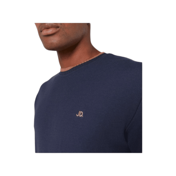 47 14B | The Jonathan D T-Shirt Saint in Navy offers a sleek, minimalist design crafted from soft, breathable cotton, providing both comfort and durability for everyday wear. Its versatile Navy hue and classic fit make it a perfect choice for effortless style, whether dressed up or down.