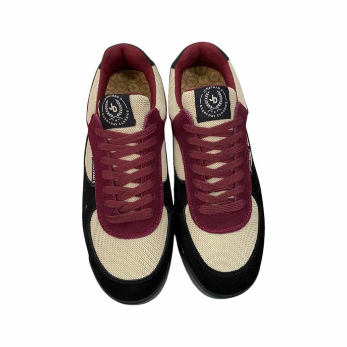 55 112C | The Jonathan D Sneaker in Jimmy Dusk Maroon/Black combines bold style and comfort, featuring a high-quality synthetic and suede upper in a striking maroon and black colorway that adds sophistication to any outfit. Its cushioned insole and breathable lining ensure all-day comfort, while the durable rubber outsole provides excellent traction and stability on various surfaces. With its sleek design and subtle stitching details, this sneaker transitions effortlessly from casual wear to more polished looks, making it a versatile and stylish addition to any modern wardrobe.