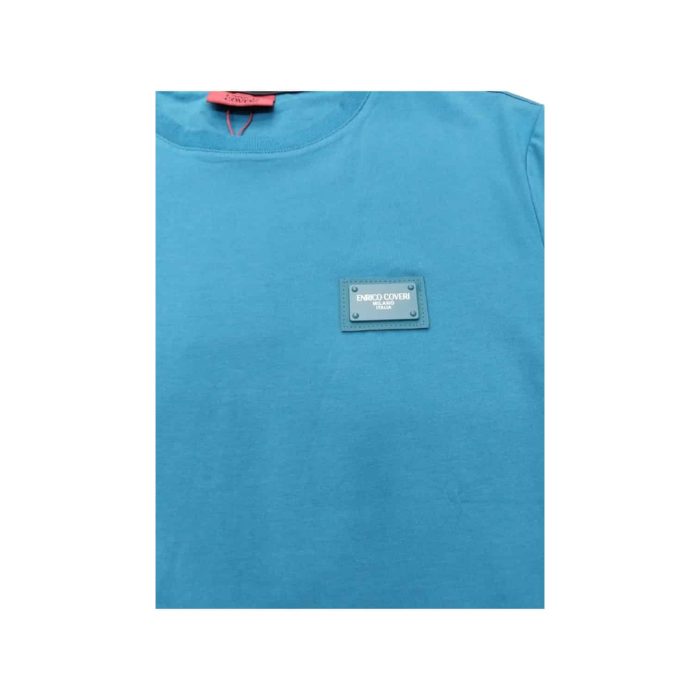 559 104 C | The Enrico Coveri T-Shirt Small Chest Logo in Lake Blue is a stylish and contemporary piece that effortlessly elevates your casual wardrobe, featuring a vibrant lake blue hue that adds a refreshing pop of color to any outfit. Crafted from high-quality cotton, this t-shirt ensures exceptional comfort and breathability, making it perfect for all-day wear, whether you're running errands, meeting friends, or simply relaxing at home. The subtle small chest logo provides a touch of sophistication, reflecting the brand's commitment to quality and attention to detail while maintaining a minimalist aesthetic that pairs beautifully with jeans, shorts, or chinos for versatile styling options.