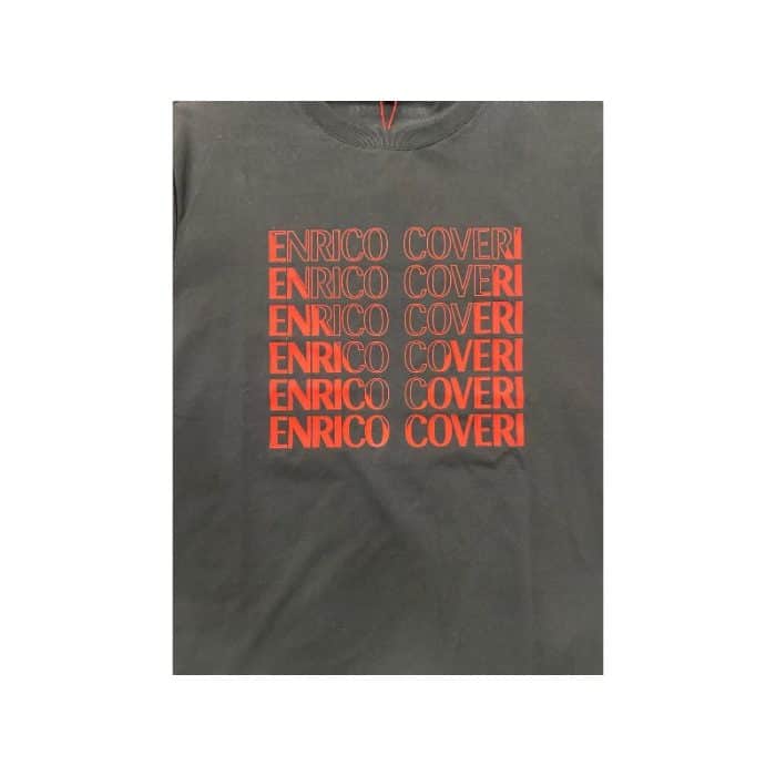 559 112B | The <em>Enrico Coveri Block Print</em> T-Shirt in Black offers a bold yet stylish look with its striking red print across the front. Made from soft, breathable fabric, this shirt provides all-day comfort while adding a pop of vibrant color to any outfit. Perfect for casual wear, it seamlessly blends modern design with Enrico Coveri’s signature flair.