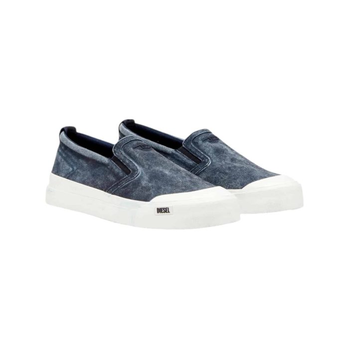 861 57A | The Diesel S-Athos Slip-On in Outer Space combines modern design with ultimate convenience, featuring a sleek silhouette crafted from premium materials that ensure both durability and style. With its deep navy hue and minimalistic aesthetic, this slip-on sneaker seamlessly transitions from casual outings to more polished looks, making it a versatile addition to any wardrobe. Designed for comfort, it includes a cushioned insole and elastic side panels that provide a snug fit, allowing you to effortlessly slip them on and enjoy all-day wear without compromising on flair.