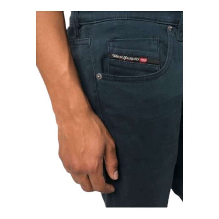 867 8 D 1 | The Diesel Jeans D-Strukt Navy combines modern style with unmatched comfort, featuring premium denim that hugs your body perfectly while allowing for easy movement throughout the day. With a classic five-pocket design and a deep navy hue, these jeans are versatile enough to transition seamlessly from casual outings to more polished events, making them a staple in any wardrobe. The subtle distressed details and straight-leg cut enhance their contemporary appeal, while reinforced stitching ensures durability, allowing you to enjoy both style and functionality for years to come.