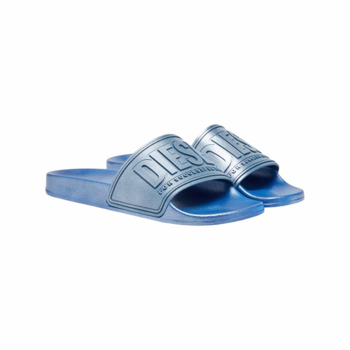 Diesel Matallic Blue 2 | The <em>Diesel SA-Mayemi CC Sandals Metallic Blue</em> effortlessly combine style and comfort, featuring a striking metallic blue finish that adds a bold touch to any casual outfit. Crafted from high-quality synthetic materials, these sandals offer a cushioned footbed for all-day comfort and support, while the slip-on design ensures easy wear and a secure fit. With a durable, textured sole providing excellent grip, these versatile sandals are perfect for everything from beach days to city strolls, making them an essential addition to your summer wardrobe.