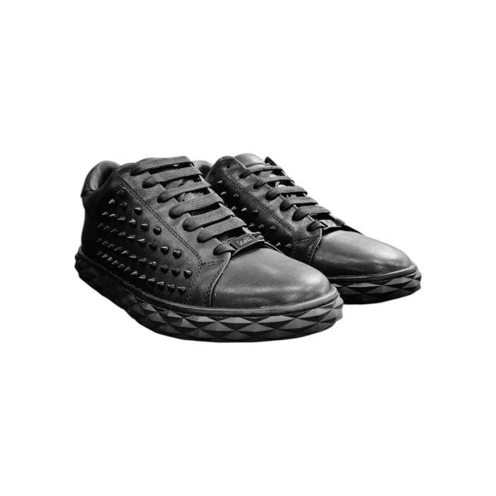 988 1B | The Vialli Sneaker Vision in black combines bold style, premium materials, and exceptional comfort, making it the ultimate choice for modern footwear. Featuring a sleek black leather upper, studded details, and a vibrant artistic sole design, these sneakers stand out with edgy sophistication. Perfect for all-day wear, they offer a snug fit, superior traction, and a rebellious flair for those who dare to be different.