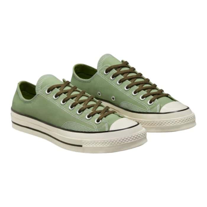 126 73 B | The Converse Chuck Low 70 Alligator Green/Utility/White combines vintage flair with a contemporary edge, featuring a durable canvas upper in a bold alligator green accented with utility and white tones. With its iconic low-top silhouette, cushioned insole, and textured rubber outsole, it delivers lasting comfort and reliable traction for everyday wear. Perfect for casual outfits or adding a pop of color to polished looks, this versatile sneaker is a stylish and timeless addition to any wardrobe.