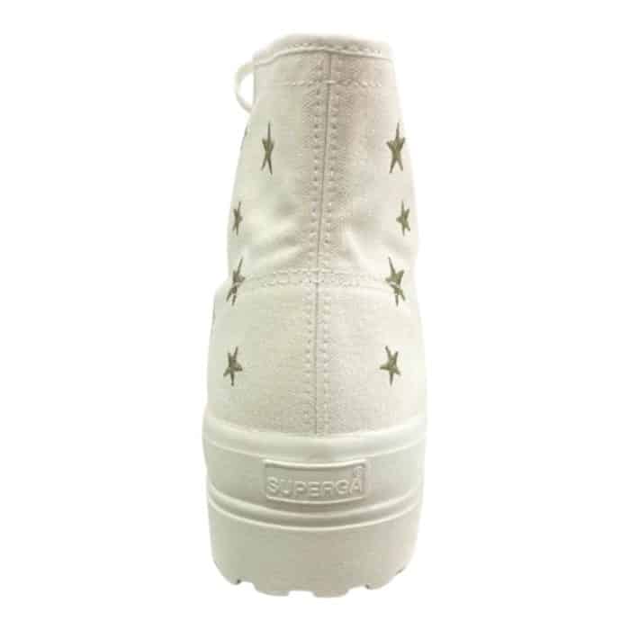 556 7 C 1 | The Superga 2341 Alpina Embroidery White/Gold Stars combines timeless elegance with rugged functionality, featuring a high-top white canvas design adorned with delicate gold star embroidery for a subtle yet eye-catching sparkle. Its signature Alpina lug sole adds a bold, edgy touch while offering excellent traction and durability, making it perfect for both casual outings and light adventures. With a comfortable padded footbed, gold-toned eyelets, and versatile styling, these sneakers effortlessly blend practicality and sophistication for any occasion.