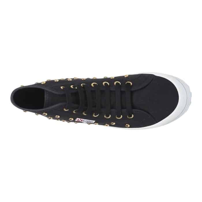 556 7 C | The Superga 2341 HI Top Alpina Studs in Black/Gold combines bold style with durable functionality, featuring a sleek black canvas upper adorned with striking gold-tone studs for a rebellious yet sophisticated look. Its chunky lug sole provides exceptional grip and stability, making it perfect for both urban adventures and rugged terrains, while the high-top design ensures added ankle support and comfort. With its edgy aesthetic, premium craftsmanship, and versatile appeal, this statement sneaker effortlessly elevates any casual outfit with a touch of glamour and attitude.