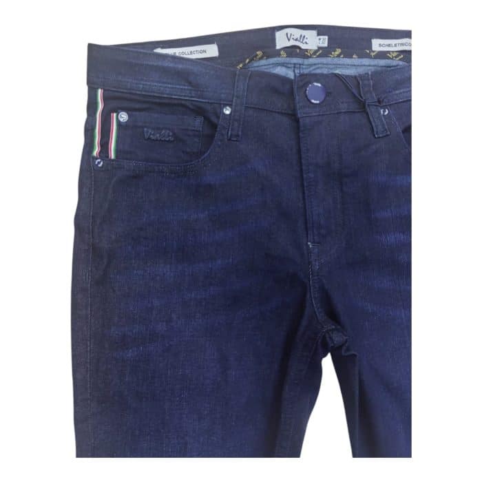 939 43 D | The Vialli Jeans Scheletrico Skinny Irrik Dark Denim combines modern style with exceptional comfort, featuring a sleek, form-fitting skinny cut that flatters every body type while providing flexibility with its premium cotton-elastane blend. The rich dark indigo wash, enhanced with subtle fading and minimalistic detailing, offers a versatile and timeless look that easily transitions from casual to semi-formal occasions. Meticulously crafted with high-quality materials and thoughtful finishing touches, these jeans deliver durability, comfort, and a sophisticated edge, making them a must-have staple for any contemporary wardrobe