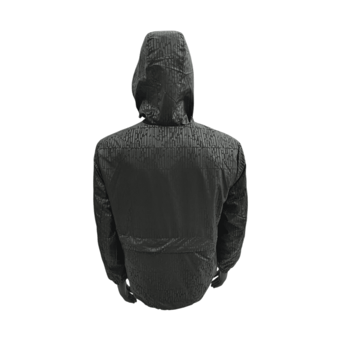 1016 5A | The Polo Harper Packable Monogram Jacket in Black combines style and functionality. Featuring a hood, zip-through design, and two pockets, it conveniently folds into a sling bag for on-the-go ease. Perfect for unpredictable weather, this lightweight jacket offers practicality and elegance in one versatile piece.