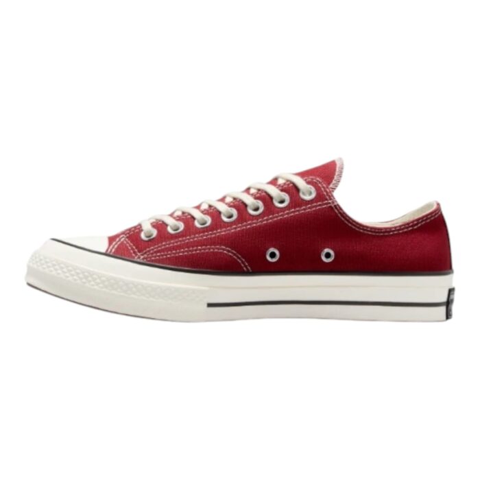 126 95 C | The Converse Chuck 70 Low in Park Red/Egret/Black is a premium reimagining of the classic Chuck Taylor silhouette, featuring a durable canvas upper in a bold red hue, complemented by Egret-colored laces and a midsole that enhance its vintage appeal. Designed for both style and comfort, it boasts a cushioned footbed, reinforced stitching, and a slightly higher rubber foxing for added support, while the vulcanized rubber sole ensures excellent traction and longevity. Whether paired with casual streetwear or a more refined outfit, this versatile sneaker seamlessly blends timeless design with modern functionality, making it a must-have for any wardrobe.