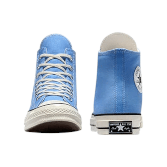 130 111D | The Converse Chuck 70 Hi Open Sky Blue/Black blends vintage charm with modern updates, featuring a bold blue canvas upper contrasted by sleek black accents for a standout look. Crafted from premium materials, it offers enhanced comfort with a cushioned OrthoLite insole and a thicker rubber sole for better support and durability. This high-top sneaker not only makes a style statement but also provides superior performance, making it perfect for everyday wear and versatile enough to pair with any outfit.