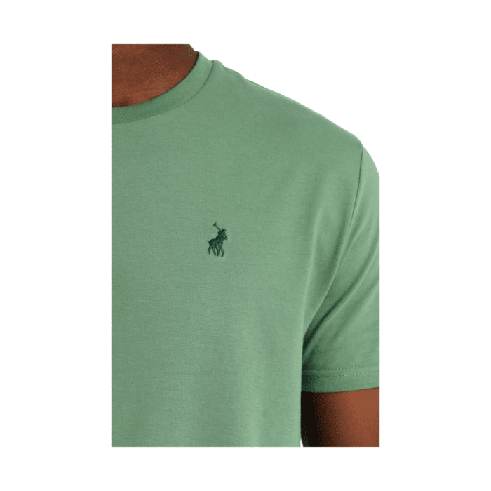 303 1DD | Stay effortlessly cool with the Polo Men’s Essential Crew Neck Short Sleeve Tee in Green. Crafted for comfort and versatility, this soft, breathable tee features a classic crew neck design and a flattering fit. Perfect for casual outings or layering, it’s a wardrobe staple for everyday wear.