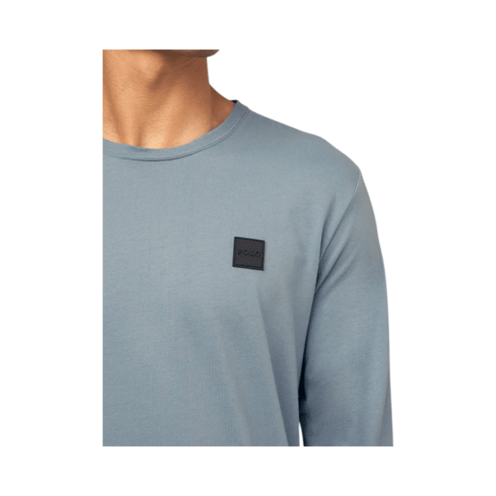 304 1BB | The Polo Essential Long Sleeve Custom Fit Crew Blue is a timeless wardrobe staple crafted from premium cotton, offering a soft, breathable feel with a tailored fit that sits perfectly between classic and slim styles for all-day comfort. Designed in a rich blue hue, this versatile long-sleeve crewneck seamlessly pairs with jeans, chinos, or joggers, making it an effortless choice for both casual and refined looks while featuring the iconic Polo embroidered logo for a touch of heritage. With ribbed cuffs and hem ensuring durability and a snug fit, this essential piece maintains its shape and style through every season, whether worn alone or layered for added warmth.