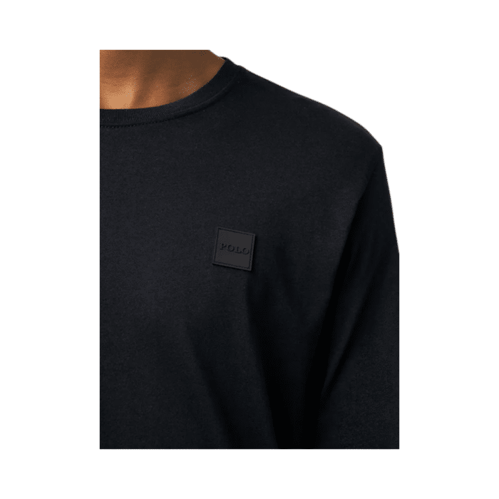 304 3EE | The Polo Essential Long Sleeve Tee Custom Fit Black is a sophisticated and versatile long-sleeve crewneck designed for those who appreciate both comfort and style, featuring a tailored fit that enhances your silhouette while allowing for effortless movement. Crafted from premium-quality cotton, this shirt offers a soft, breathable feel with durable ribbed cuffs and neckline, ensuring long-lasting wear and resistance to shrinking or fading even after multiple washes. Perfect for layering or wearing on its own, its timeless black color effortlessly pairs with any outfit, making it an essential wardrobe staple for casual and semi-formal occasions alike.