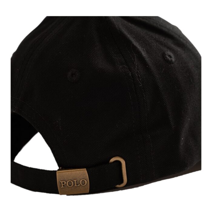 318 2 C | The Polo Cap 6 Panel Classic Peak Black combines timeless style, durability, and comfort with its structured six-panel construction and curved peak, offering both a secure fit and effective sun protection. Crafted from premium-quality fabric, this cap ensures breathability and long-lasting wear, while the adjustable strap at the back provides a customizable fit for all head sizes. With its sleek black design, subtle embroidered Polo logo, and strategically placed ventilation eyelets, this versatile cap effortlessly complements any outfit, making it the perfect choice for casual outings, sports activities, or everyday wear.