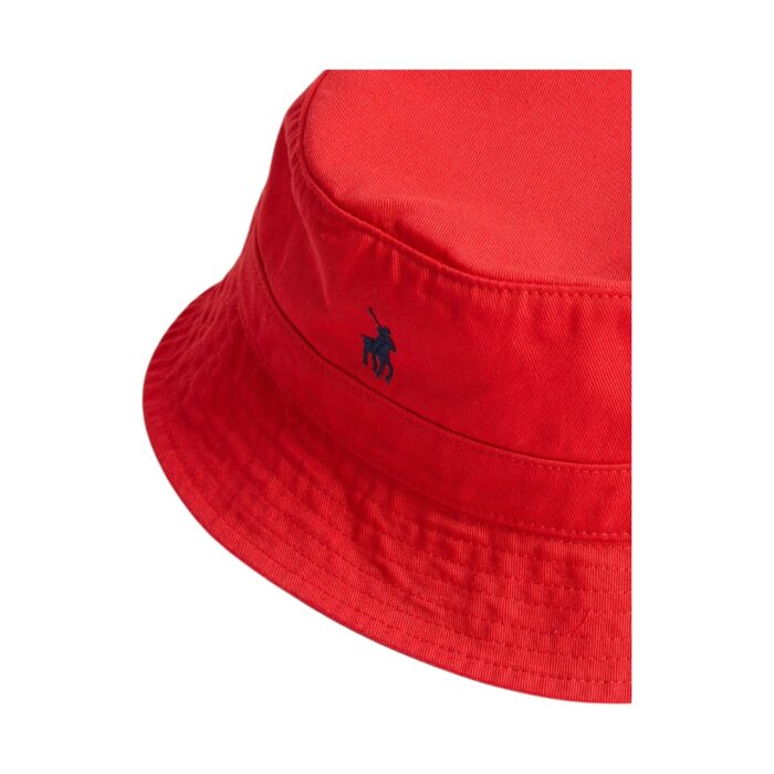 319 22 B | The Polo Sydney Twill Bucket Hat in Red offers a perfect blend of style and functionality. Made from durable twill fabric, this hat is lightweight, comfortable, and built to last. Its bold red color adds a pop of vibrancy to any outfit, while the wide brim provides excellent sun protection. With a soft, breathable lining for extra comfort and an adjustable fit for a personalized experience, this bucket hat is ideal for both casual outings and outdoor activities. Whether you're at the beach or running errands, the Polo Sydney Twill Bucket Hat combines fashion and practicality effortlessly.