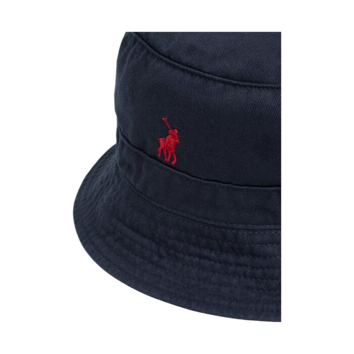 319 8 A | The Polo Sydney Twill Bucket Hat in Navy combines classic style with modern practicality, featuring high-quality twill fabric that ensures durability, breathability, and a comfortable fit for all-day wear. Its deep navy hue and timeless bucket silhouette make it a versatile accessory that effortlessly complements various outfits, while the subtle Polo branding adds a touch of sophistication. Designed for both fashion and function, this hat provides excellent sun protection with its wide brim, and its lightweight, packable design makes it the perfect companion for travel, outdoor adventures, and everyday style.