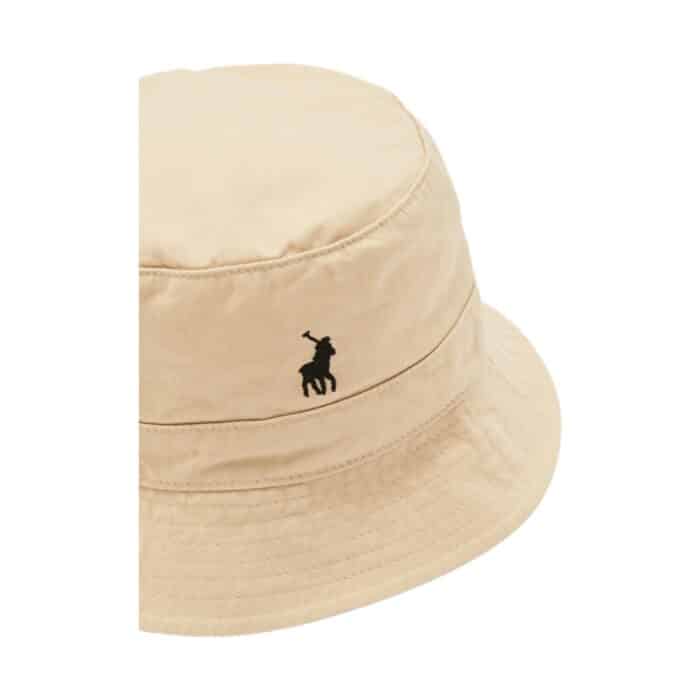 319 9 A | <p data-pm-slice="1 1 []">The Polo Sydney Twill Bucket Hat in Stone is a stylish and versatile accessory crafted from high-quality twill fabric, offering durability and a comfortable fit for various occasions. With its neutral stone color and minimalist aesthetic, this hat effortlessly complements different outfits while the subtle Polo branding adds a refined touch to your look. Designed for both fashion and functionality, it features breathable material for all-day comfort, a wide brim for sun protection, and a relaxed yet secure fit, making it an essential piece for any wardrobe.</p>