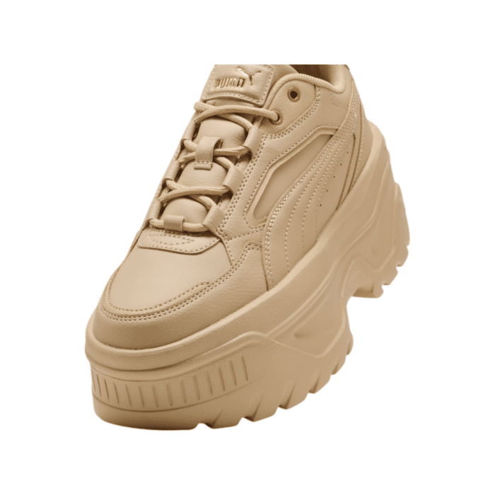 334 89C | Elevate your style with Puma Karmen X-TRA Trainers in Light Sand/Gold. Featuring a chunky platform sole and sleek design, they blend comfort, durability, and trendiness.