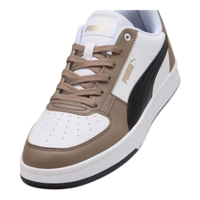 5 194 D | The Puma Caven 2.0 Taupe / Black / White sneakers seamlessly blend modern design with exceptional comfort, featuring a premium leather and synthetic upper that ensures durability and flexibility while offering a sleek, minimalist look. The cushioned insole and padded collar provide all-day support, while the rubber outsole delivers reliable traction on various surfaces, making them perfect for both casual outings and light athletic activities. With their subtle Puma branding and versatile colorway, these sneakers offer a sophisticated yet understated style that easily complements any wardrobe.