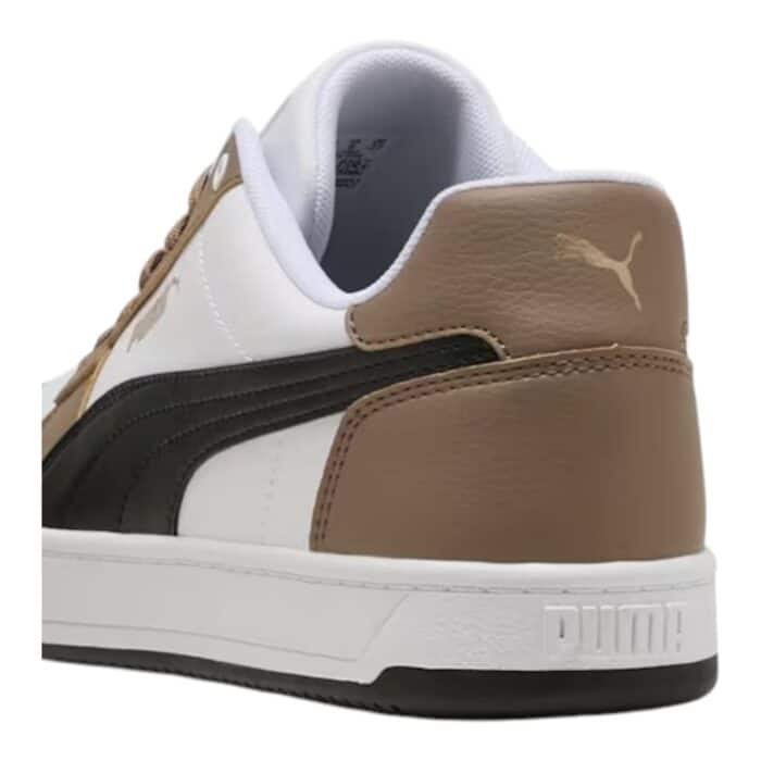 5 194 E | The Puma Caven 2.0 Taupe / Black / White sneakers seamlessly blend modern design with exceptional comfort, featuring a premium leather and synthetic upper that ensures durability and flexibility while offering a sleek, minimalist look. The cushioned insole and padded collar provide all-day support, while the rubber outsole delivers reliable traction on various surfaces, making them perfect for both casual outings and light athletic activities. With their subtle Puma branding and versatile colorway, these sneakers offer a sophisticated yet understated style that easily complements any wardrobe.