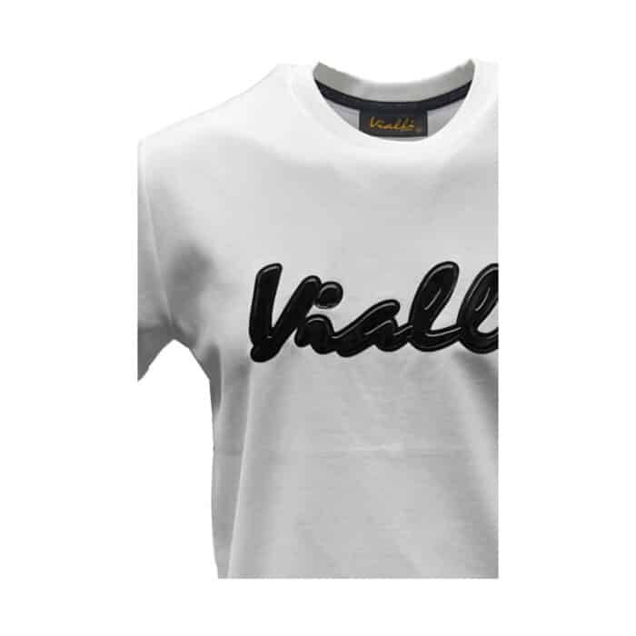 938 79 B 1 | The Vialli T-Shirt Just In White is a stylish and versatile wardrobe essential, crafted from premium cotton for a soft and breathable fit that ensures all-day comfort. With its minimalist design, featuring a crew neckline and subtle branding on the chest, this shirt offers a sleek, contemporary look that can be easily dressed up or down for various occasions. Whether you're pairing it with jeans for a casual day out or layering it under a jacket for a more polished ensemble, the Vialli T-Shirt Just In White combines timeless elegance with effortless style.